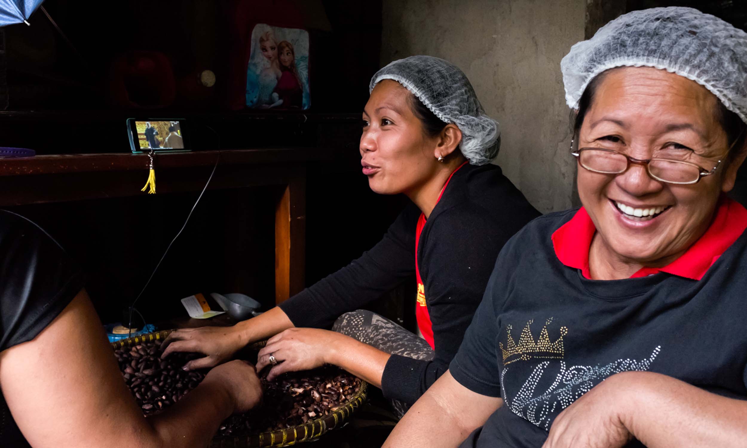 Women wearing hair nets working in the food services industry