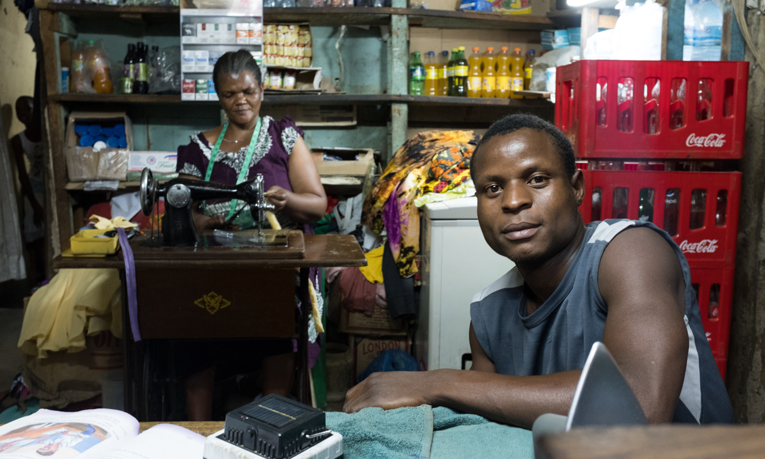 A man and a woman in their sewing shop